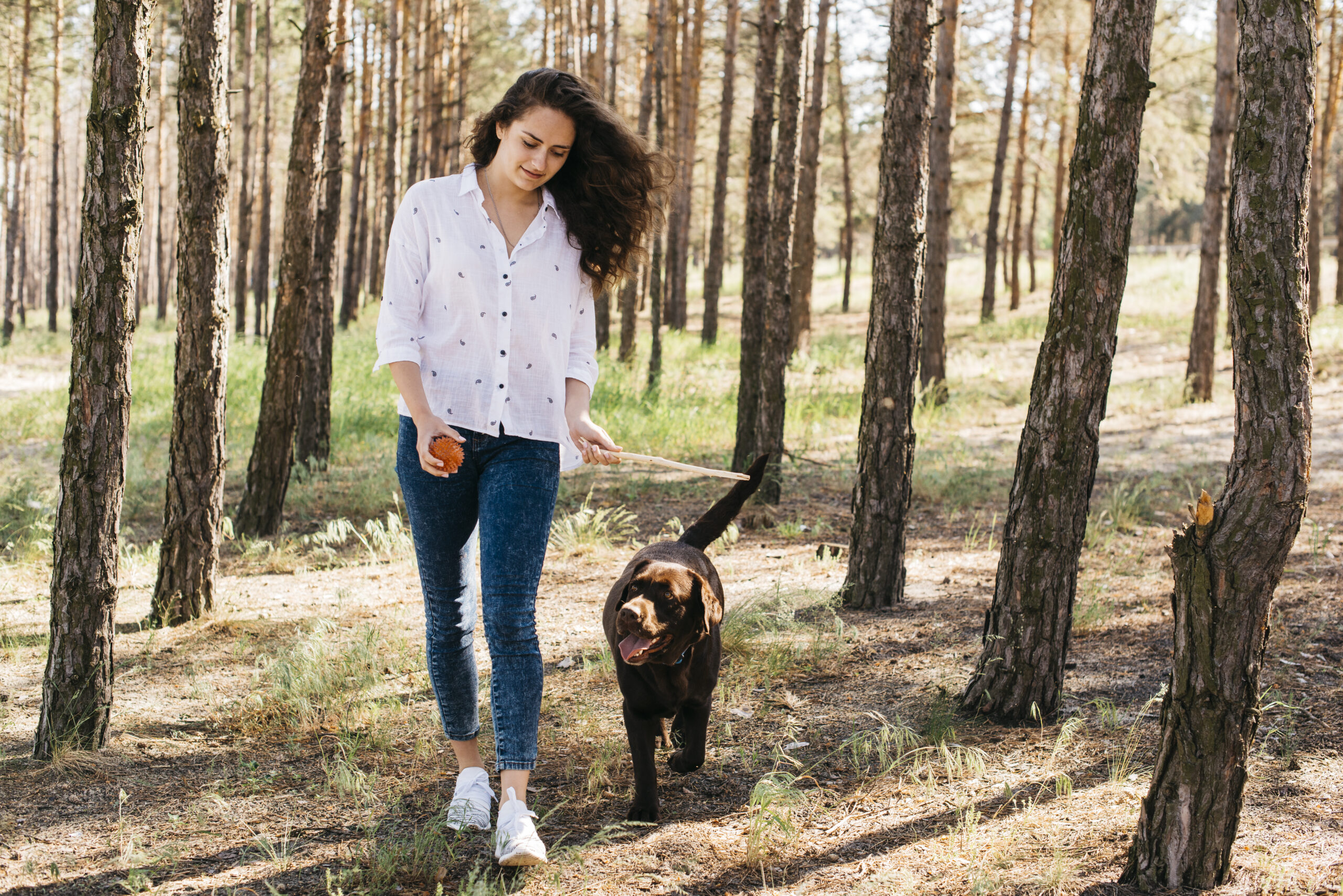 young-woman-doing-picnic-with-her-dog